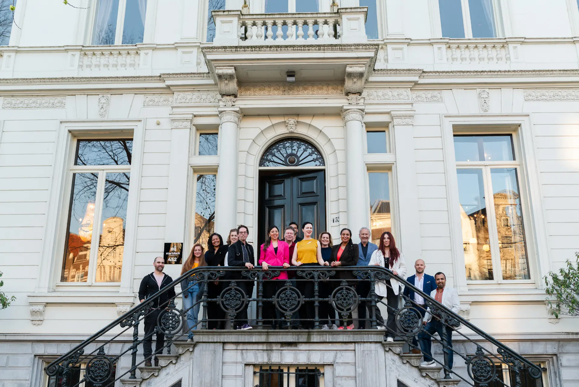 The Eureka Creates team together on the steps of the Amsterdam studio