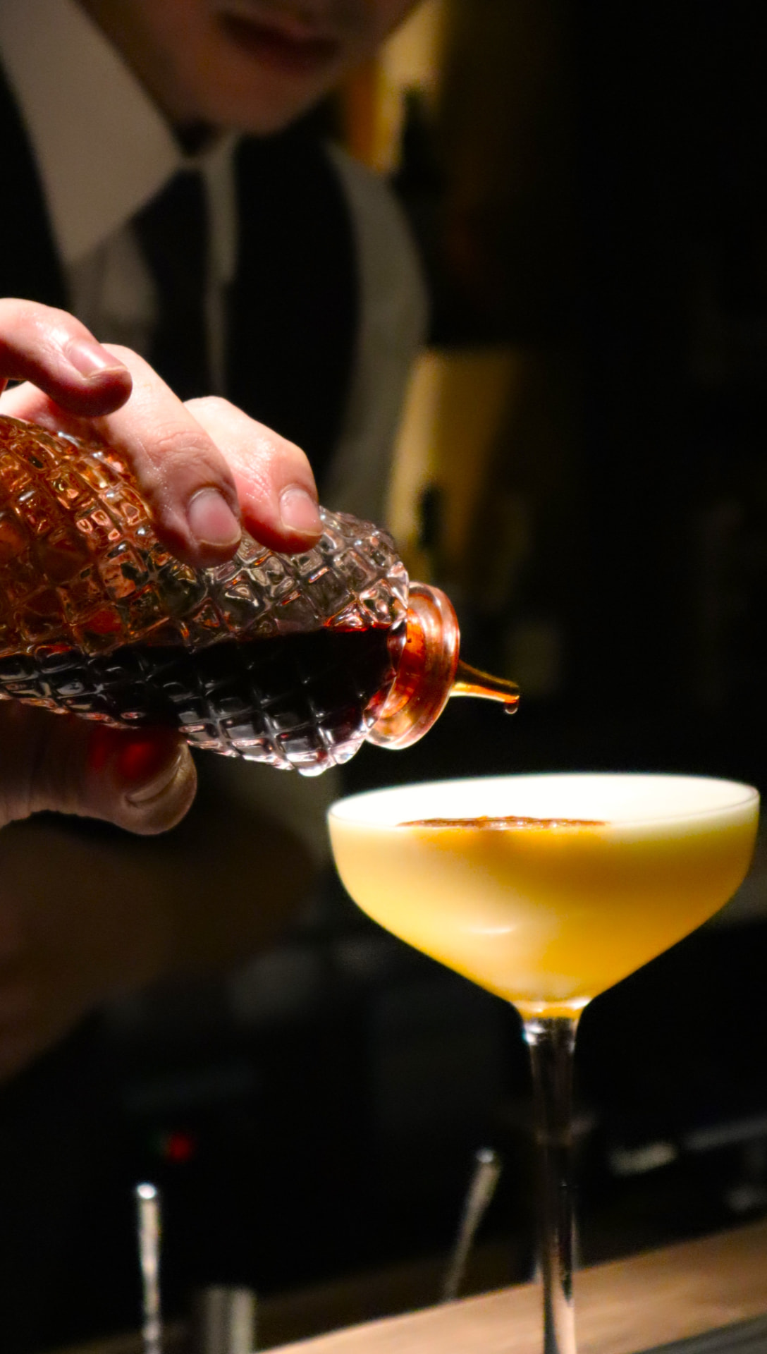 The Hammond bartender pouring a cocktail